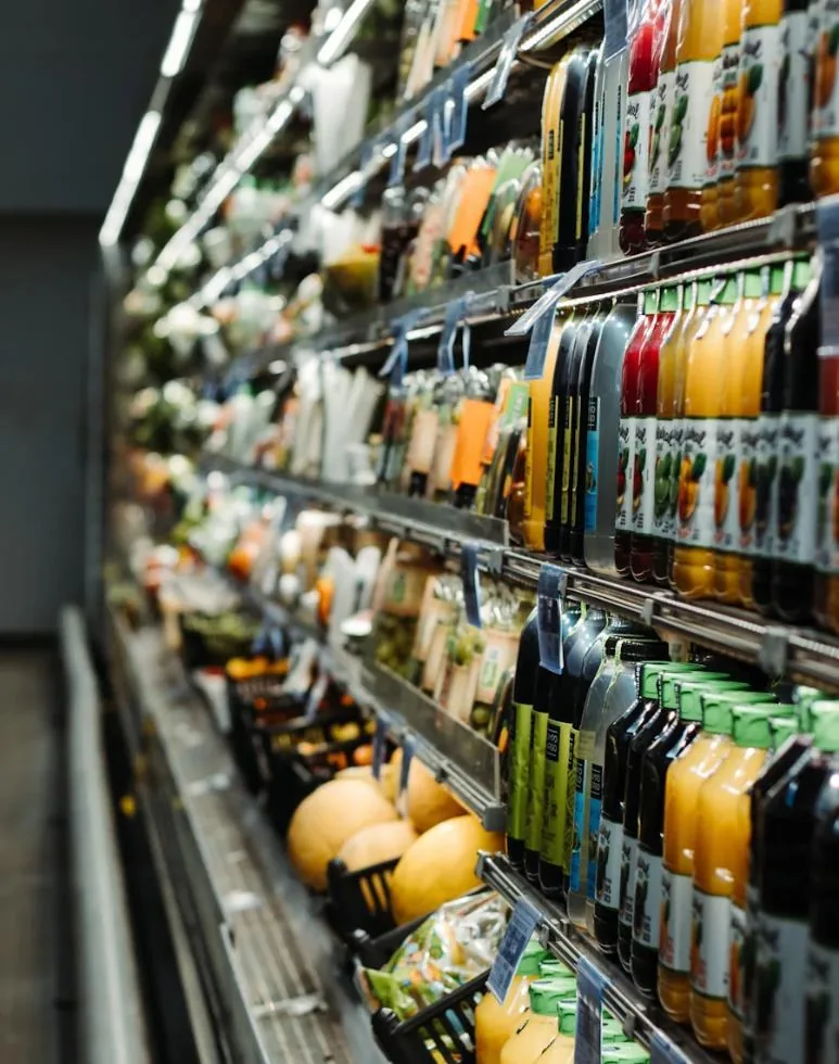 A chiller wall lined with bottled juices and cold drinks